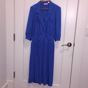 Women’s dress. Crossover bodice and pleated skirt